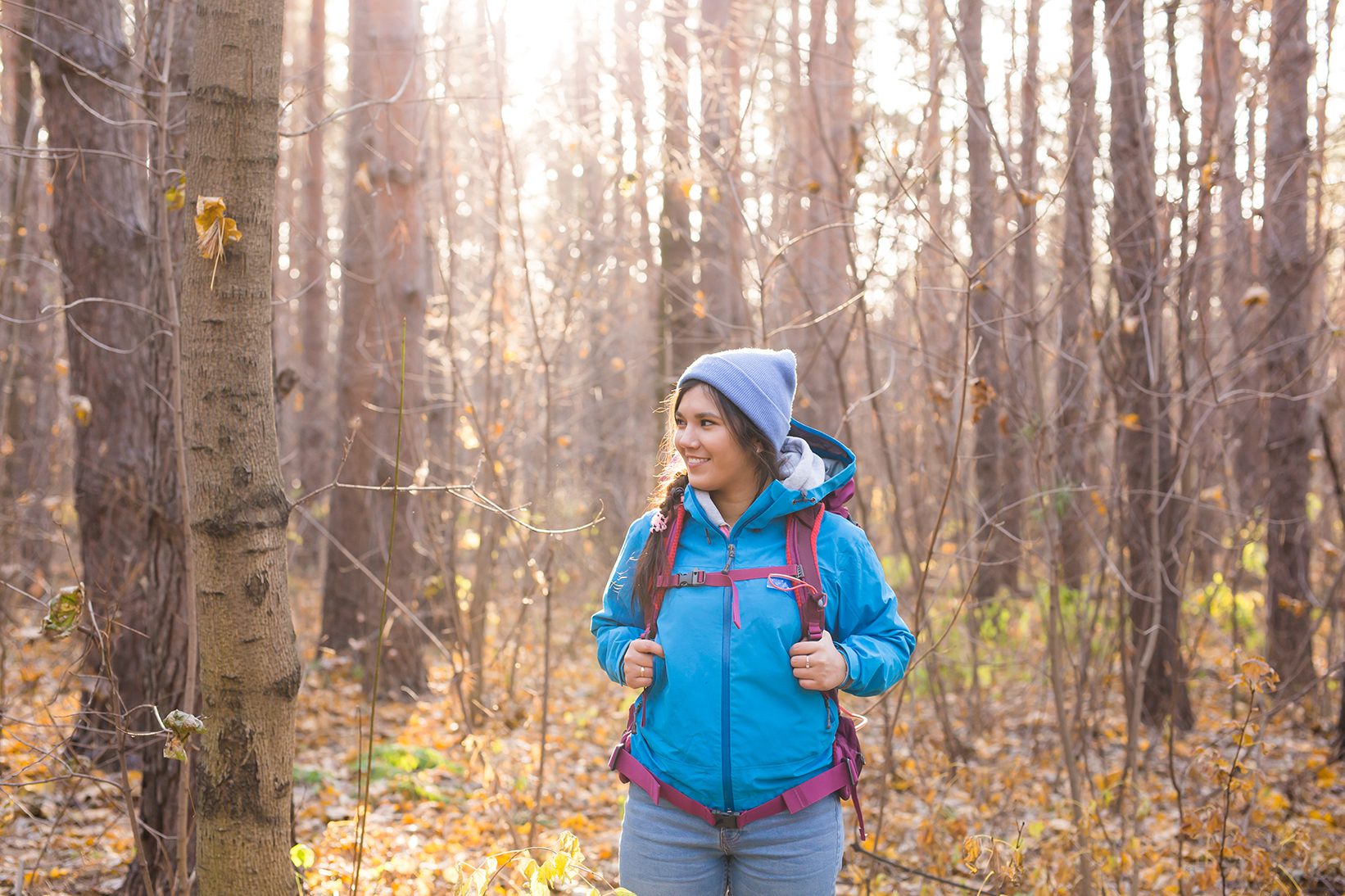 Woman hiking and exploring a forest