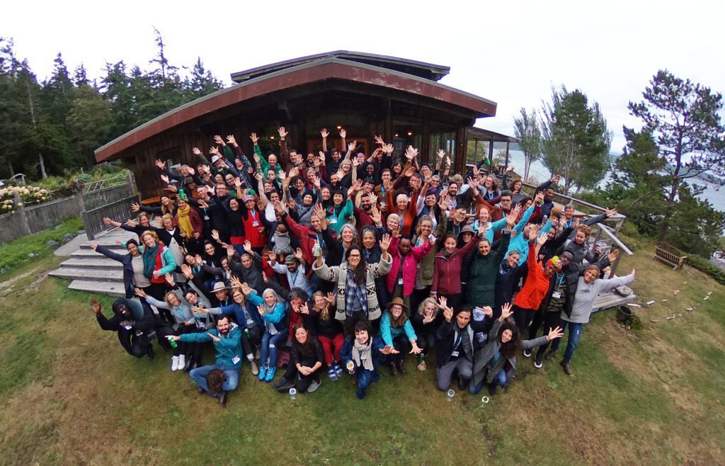 Hollyhock´s Leadership Institute students and staff raising hands for the photo